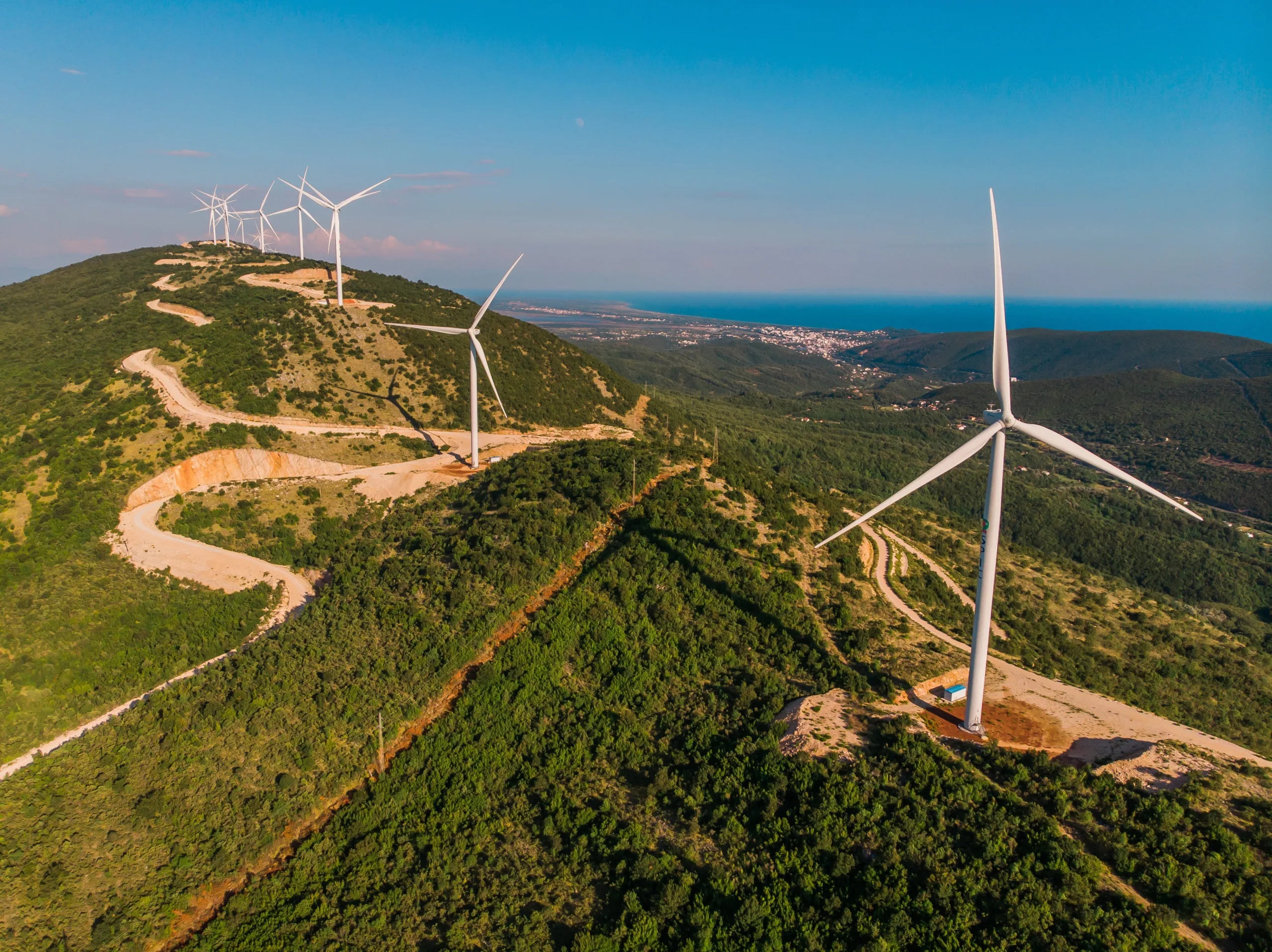 wind turbines on hill with coastline in background 2026 03 23 23 18 05 utc (1)